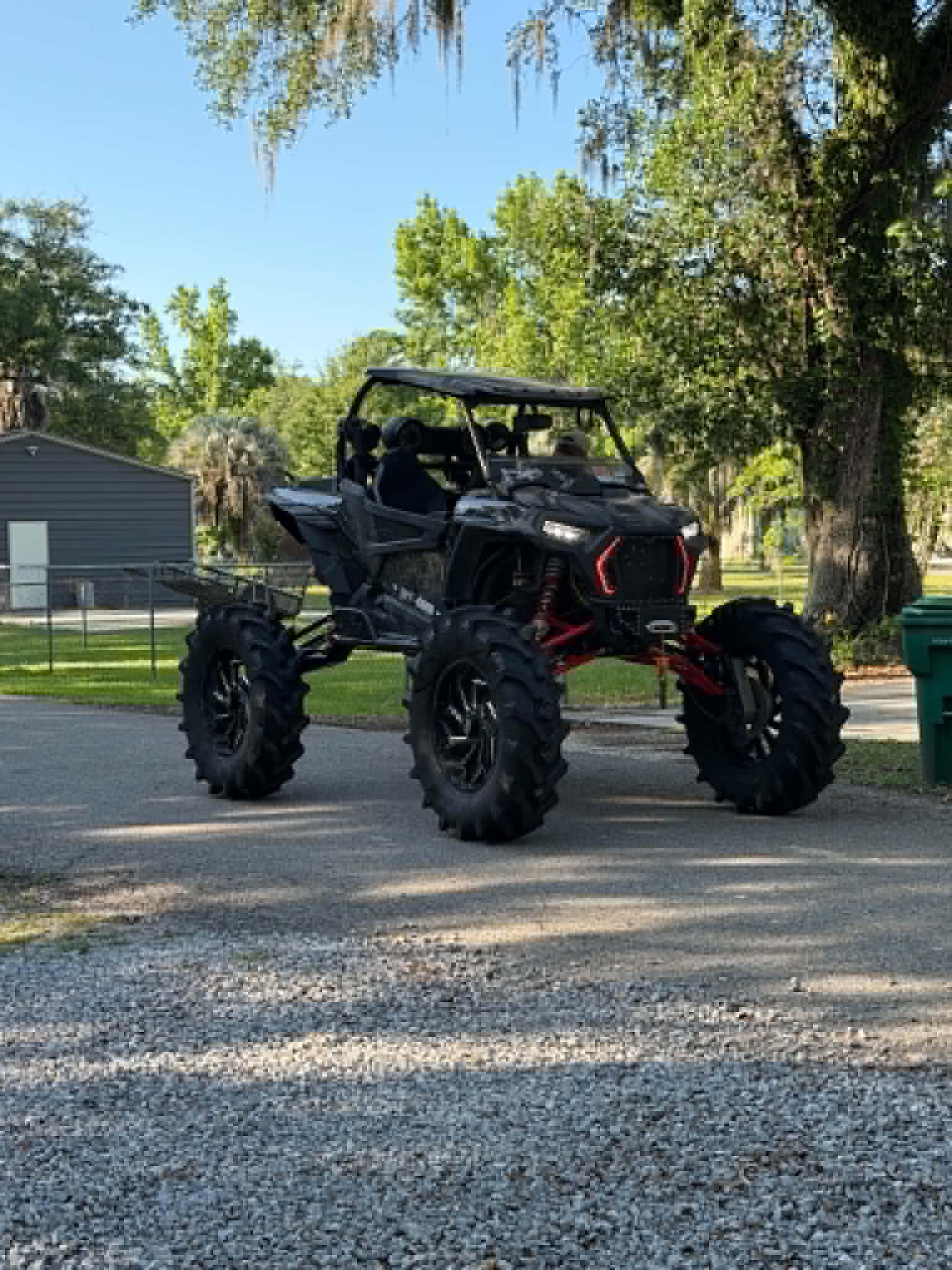 Custom side-by-side plowing through the mud